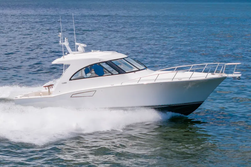 Slide: The Image of 2013 Cabo 40 Hardtop Express cruising on open water. - 26