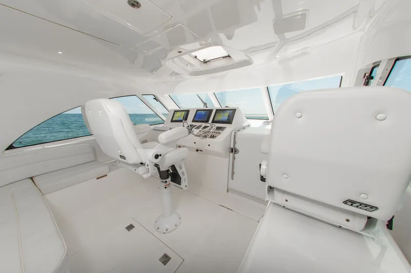 Slide: The Image of Interior of 2013 Cabo 40 Hardtop Express yacht with modern navigation equipment. - 13