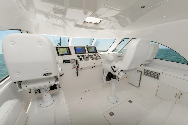 Slide: The Image of Interior of 2013 Cabo 40 Hardtop Express yacht with modern navigation equipment. - 16