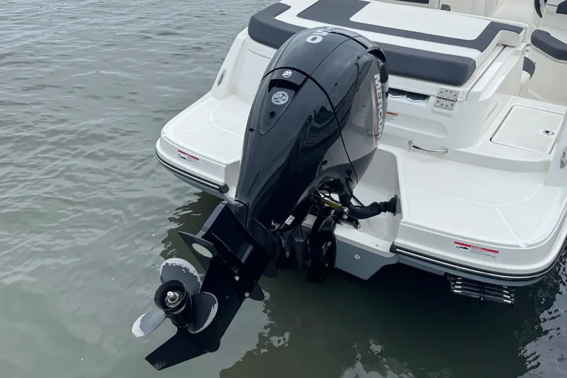 Slide: The Image of 2024 Bayliner VR6 Bowrider OB with Mercury outboard motor on calm water. - 7