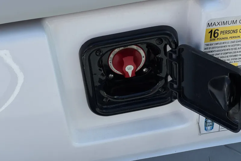 Slide: The Image of 2022 Axis T23 boat fuel cap with safety label, accommodating up to 16 persons. - 26