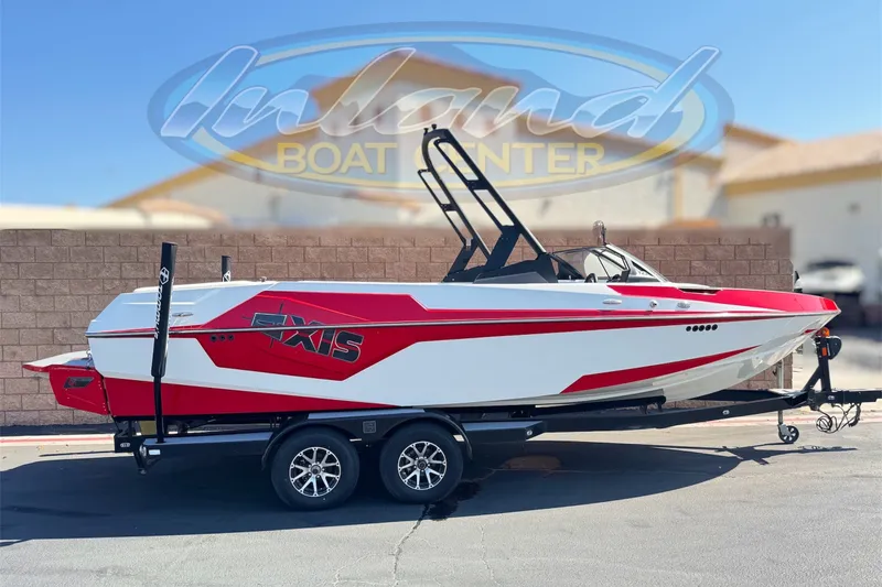 The Image of 2022 Axis T23 boat in red and white on a trailer at Inland Boat Center. - 0