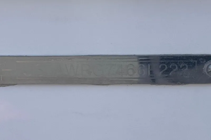 Slide: The Image of Close-up of Axis T23 2022 metal identification plate with engraved serial number. - 37