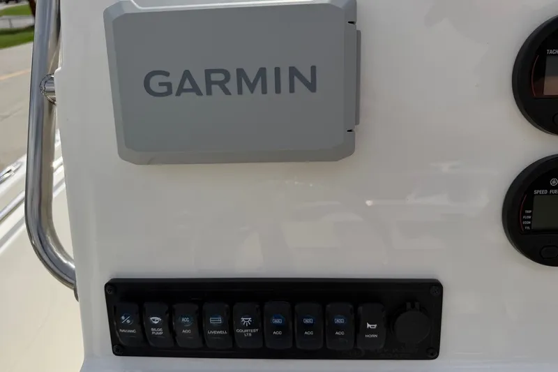 Slide: The Image of Garmin navigation system on 2026 Key West 189 FS boat dashboard with control panel. - 13