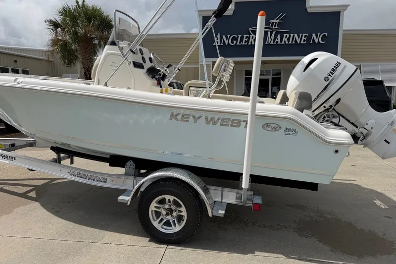Slide: The Image of 2026 Key West 189 FS boat on trailer at Angler Marine NC dealership. - 2