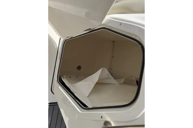 Slide: The Image of Open storage compartment on 2026 Key West 189 FS boat. - 18
