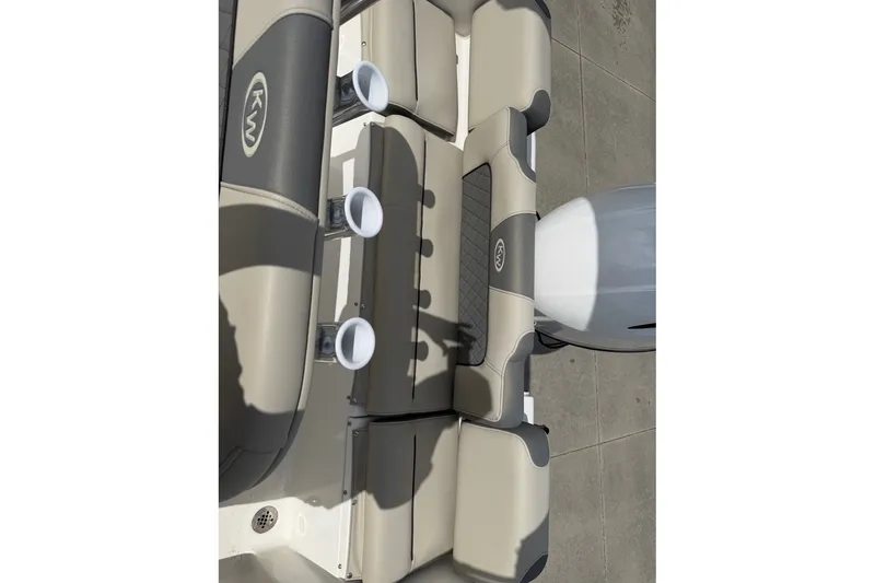 Slide: The Image of 2026 Key West 189 FS boat interior with beige seating and cup holders. - 7