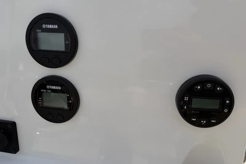 Slide: The Image of Yamaha gauges and controls on 2026 Key West 189 FS boat dashboard. - 12