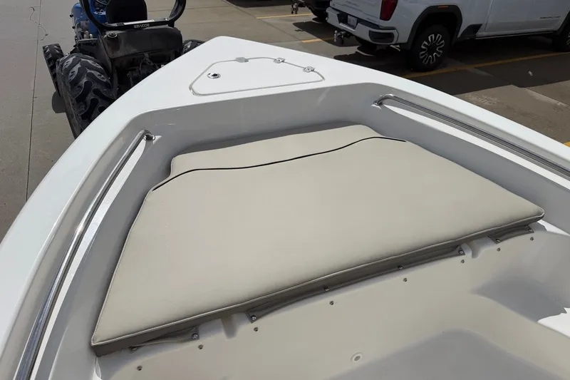 Slide: The Image of Bow seating area of 2026 Key West 189 FS boat, featuring cushioned seats and stainless steel rails. - 21