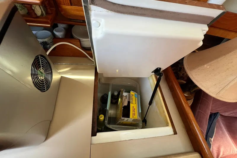 Slide: The Image of Open storage compartment in 1990 Hunter Legend 35.5 yacht interior. - 19