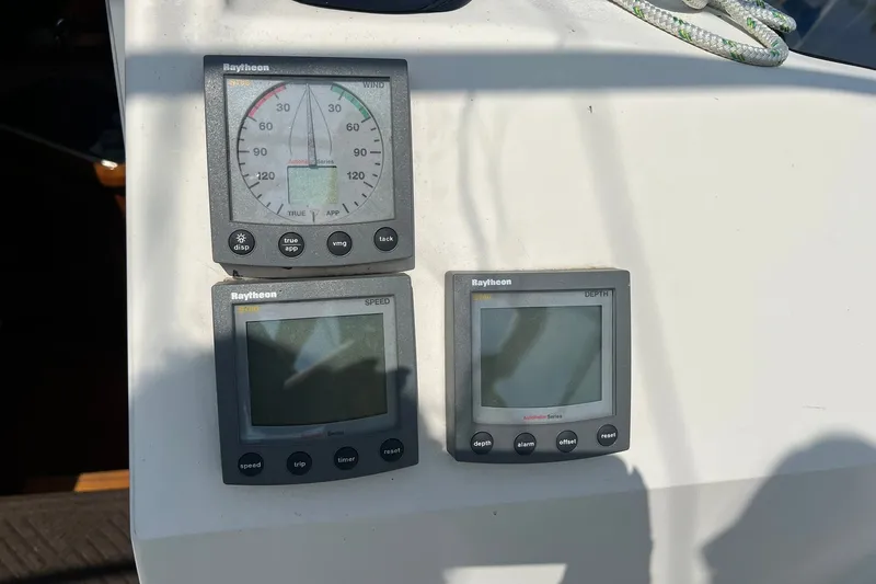 Slide: The Image of Raytheon marine instruments on a 1990 Hunter Legend 35.5 sailboat dashboard. - 13