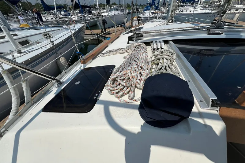 Slide: The Image of Deck of 1990 Hunter Legend 35.5 sailboat with ropes and hatch. - 7