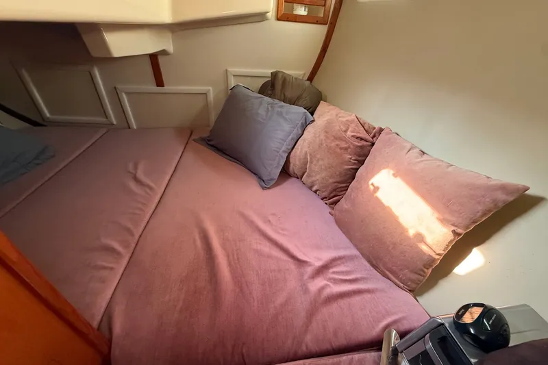 Slide: The Image of Cozy cabin interior of 1990 Hunter Legend 35.5 sailboat with plush bedding. - 36