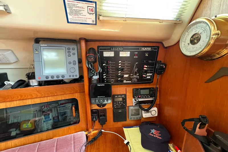 Slide: The Image of Control panel of a 1990 Hunter Legend 35.5 sailboat with navigation equipment. - 28