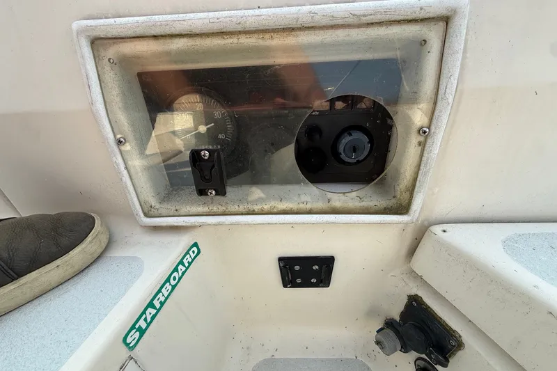 Slide: The Image of Control panel of a 1990 Hunter Legend 35.5 sailboat, featuring navigation instruments. - 14