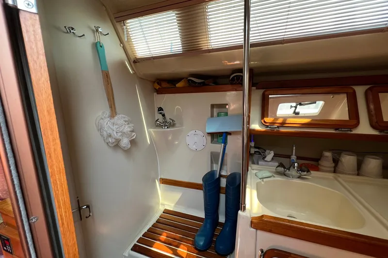 Slide: The Image of Interior of 1990 Hunter Legend 35.5 sailboat bathroom with shower and sink. - 29