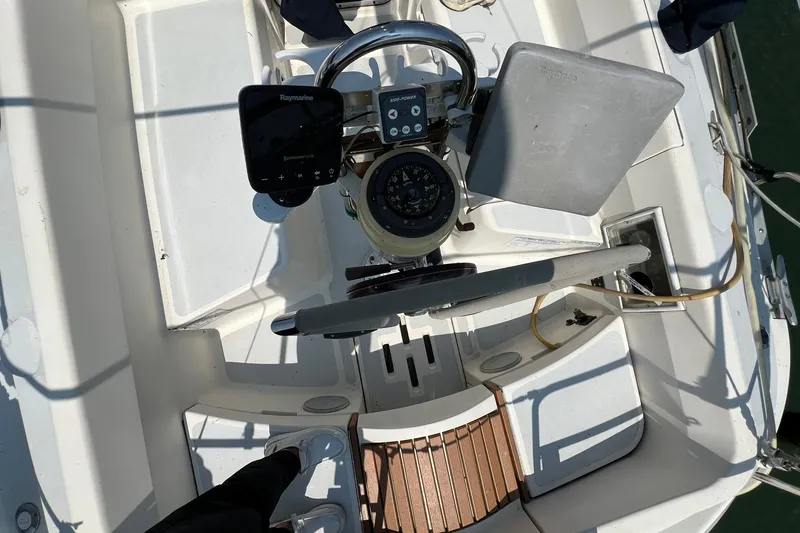 Slide: The Image of Cockpit of 1990 Hunter Legend 35.5 sailboat with navigation equipment and steering wheel. - 9