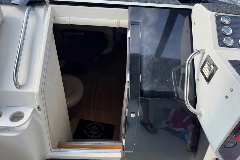 Slide: The Image of Interior view of a 1990 Silverton 34 Express boat cabin entrance. - 16