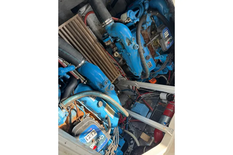 Slide: The Image of Engine compartment of a 1990 Silverton 34 Express boat, featuring Crusader engines. - 28