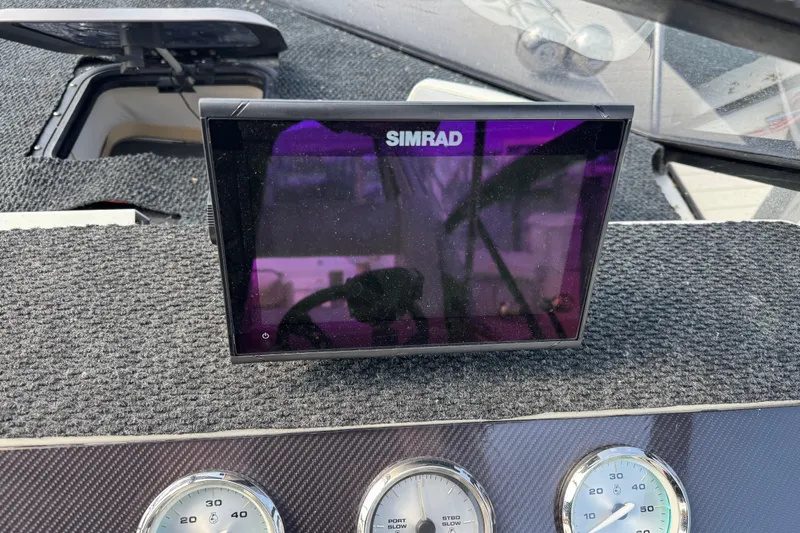Slide: The Image of Simrad display on 1990 Silverton 34 Express boat dashboard with gauges. - 15