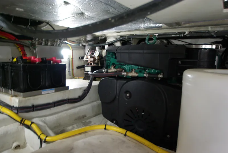 Slide: The Image of The engine room of a 2016 Galeon 430 HTC shows batteries and wiring. - 54