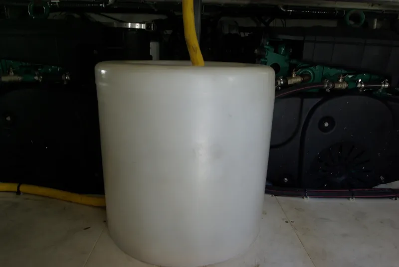 Slide: The Image of A white cylindrical tank in the engine room of a 2016 Galeon 430 HTC. - 56