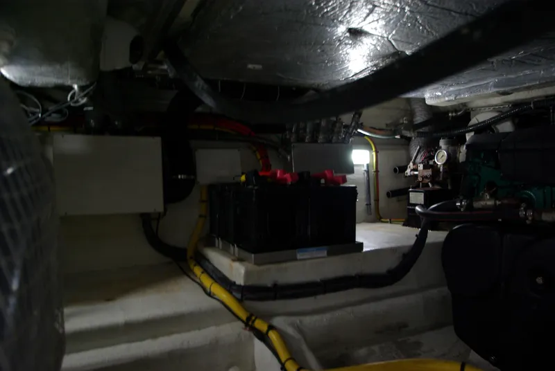 Slide: The Image of The engine room of a 2016 Galeon 430 HTC shows batteries and wiring. - 55