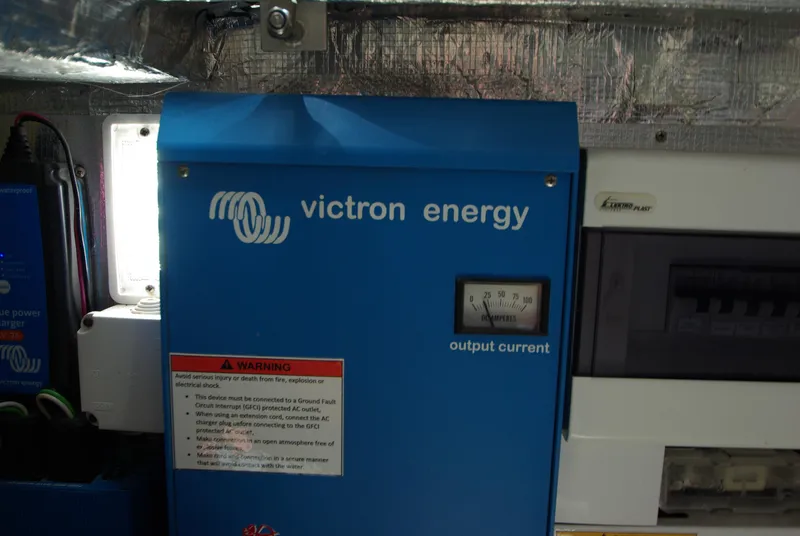Slide: The Image of A Victron Energy device with an output current gauge inside a boat. - 58