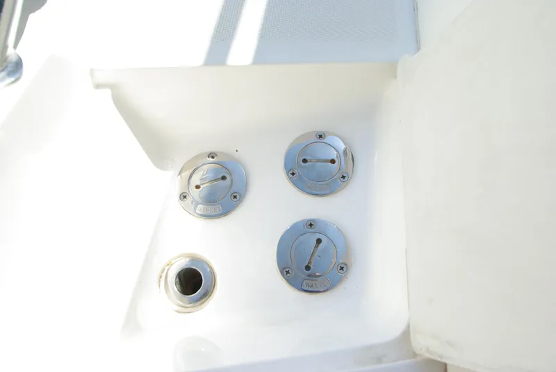 Slide: The Image of Three round metal covers and an opening on a white boat. - 51