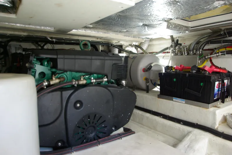 Slide: The Image of The engine room of a 2016 Galeon 430 HTC shows the engine and battery. - 53