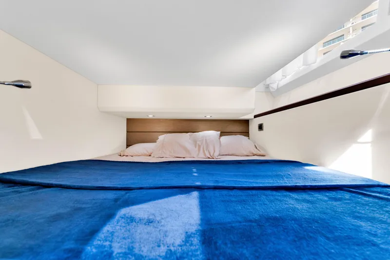 Slide: The Image of Luxurious cabin interior of 2016 Galeon 430 HTC yacht with blue bedding. - 30