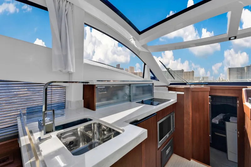 Slide: The Image of Luxurious interior of 2016 Galeon 430 HTC yacht with modern kitchen and panoramic windows. - 19