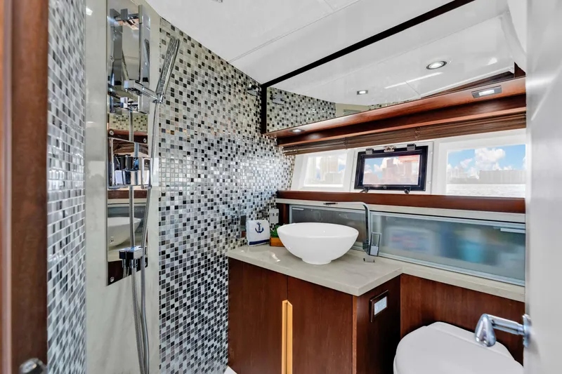 Slide: The Image of Luxurious bathroom in 2016 Galeon 430 HTC yacht with modern fixtures and mosaic tiles. - 26