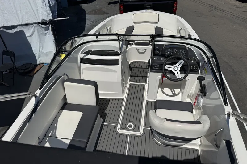 Slide: The Image of 2023 Bayliner VR4 Bowrider I/O interior with sleek seating and modern dashboard design. - 11