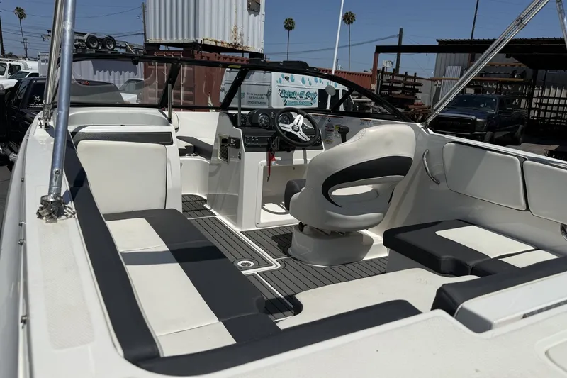 Slide: The Image of 2023 Bayliner VR4 Bowrider I/O interior with sleek seating and modern dashboard design. - 18