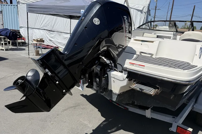 Slide: The Image of 2023 Bayliner VR4 Bowrider I/O with Mercury outboard engine, parked on a trailer. - 12