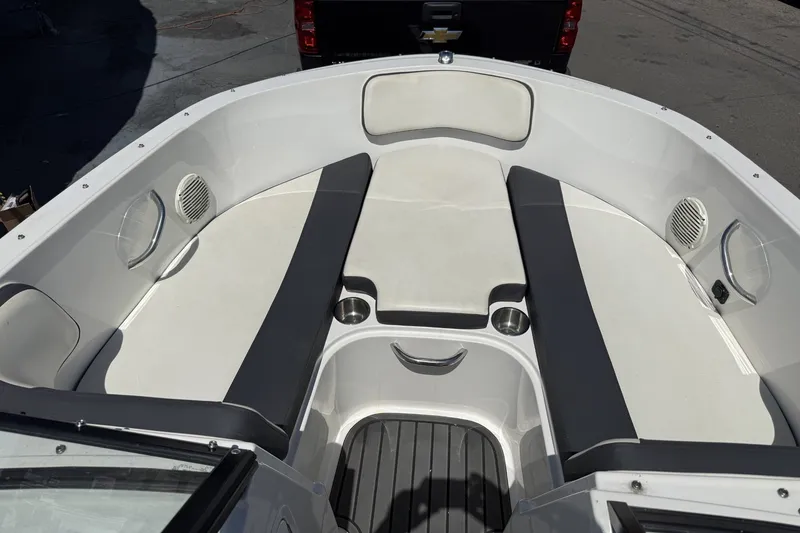 Slide: The Image of 2023 Bayliner VR4 Bowrider I/O interior with cushioned seating and cup holders. - 13