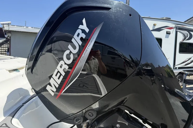 Slide: The Image of Mercury FourStroke engine on 2023 Bayliner VR4 Bowrider I/O boat, outdoor setting. - 8
