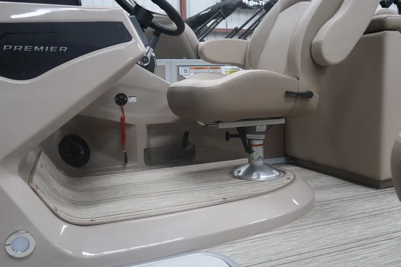 Slide: The Image of Premier 210 Sunsation RF - CL 2026 boat interior with captain's chair and console. - 13