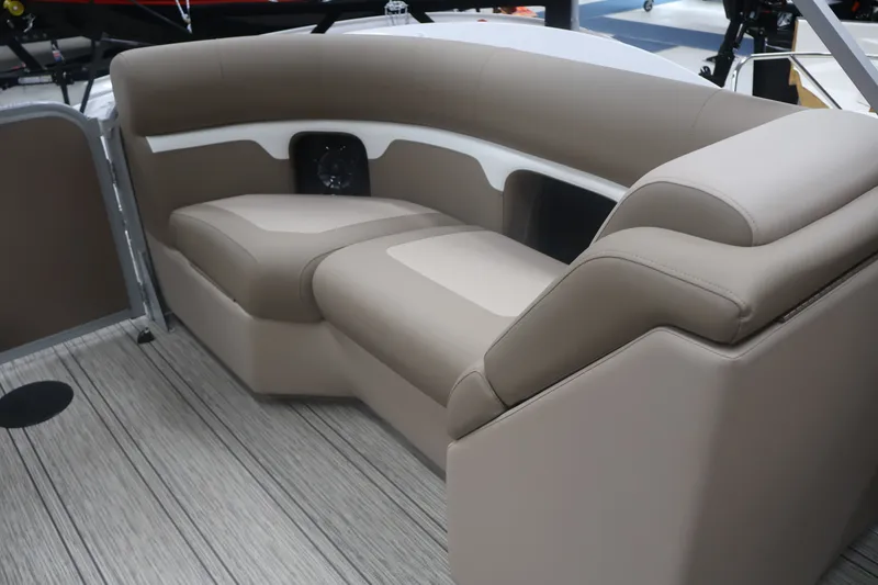 Slide: The Image of Luxurious seating on 2026 Premier 210 Sunsation RF - CL pontoon boat, featuring beige upholstery. - 22