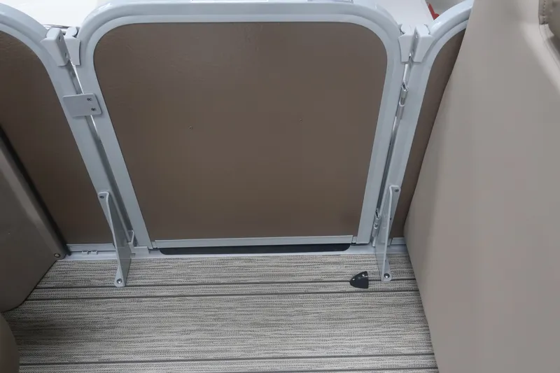 Slide: The Image of 2026 Premier 210 Sunsation RF - CL boat interior gate and flooring detail. - 14