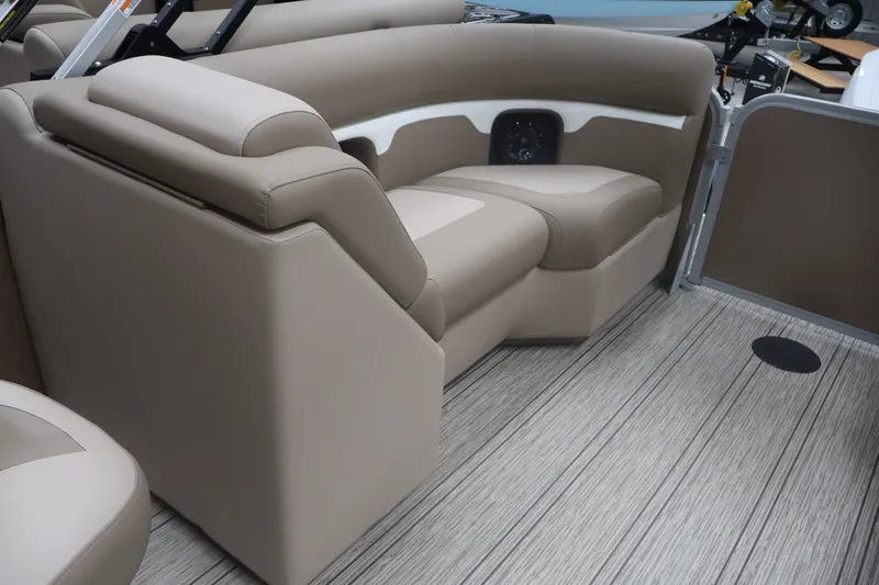 Slide: The Image of 2026 Premier 210 Sunsation RF - CL boat interior with beige seating and modern flooring. - 23