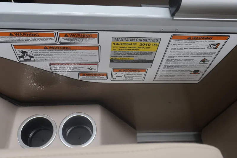 Slide: The Image of Warning labels and capacity information on a 2026 Premier 210 Sunsation RF - CL boat. - 19
