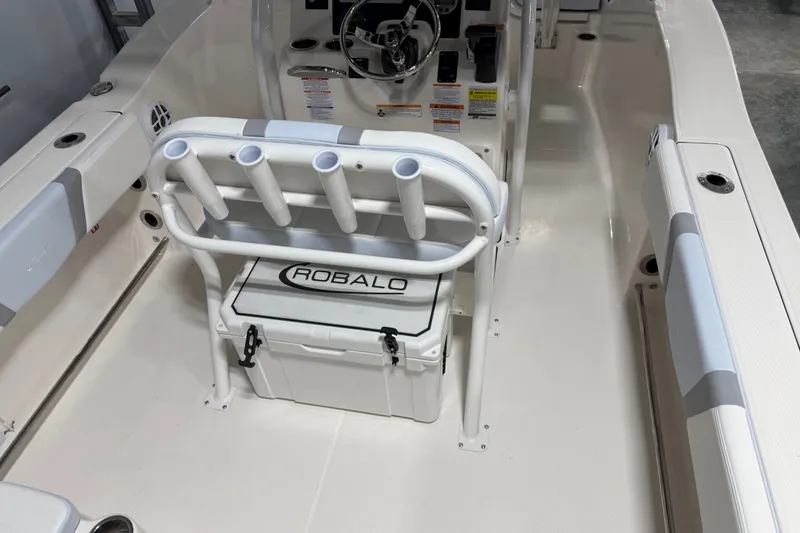 Slide: The Image of 2026 Robalo R200 Center Console boat interior with rod holders and storage. - 6