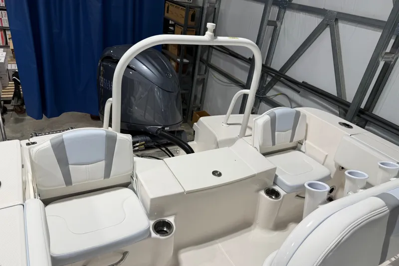 Slide: The Image of 2026 Robalo R200 Center Console boat interior with seating and engine view. - 3