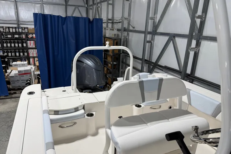 Slide: The Image of 2026 Robalo R200 Center Console boat interior in a storage facility. - 7
