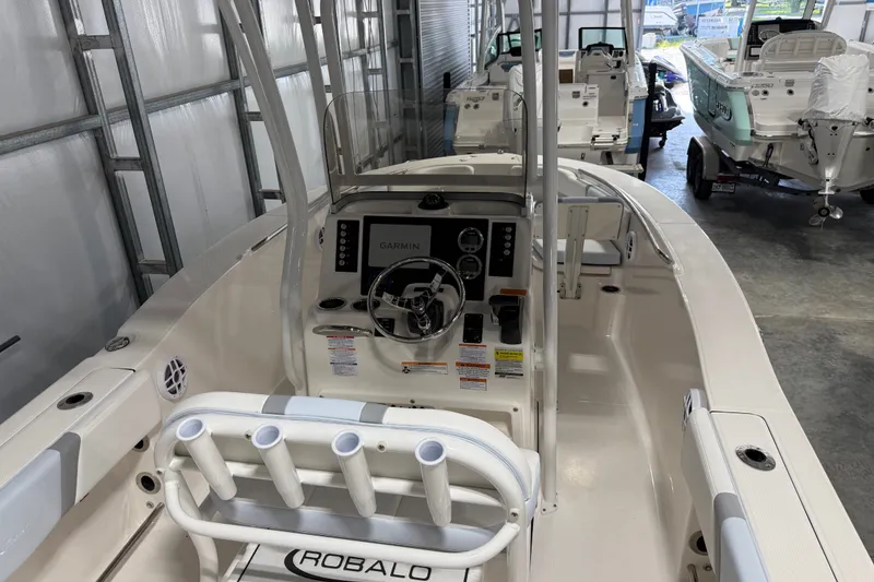 Slide: The Image of 2026 Robalo R200 Center Console boat interior with Garmin navigation system in showroom. - 5