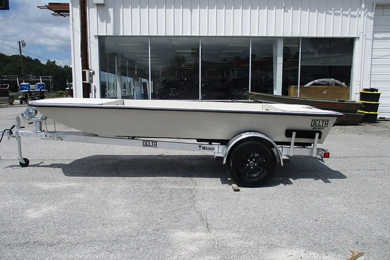 The Image of 2027 Delta Boatworks DELTA D1550 on trailer, parked outside a showroom. - 1