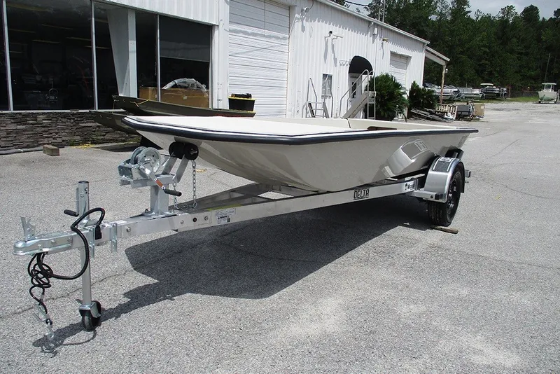 Slide: The Image of 2027 Delta Boatworks DELTA D1550 on trailer, parked outside a workshop. - 3