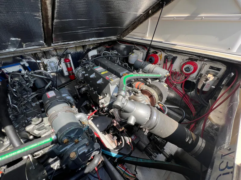 Slide: The Image of The engine compartment of a 2002 Albemarle 280 Express Fisherman with visible engines and wiring. - 23